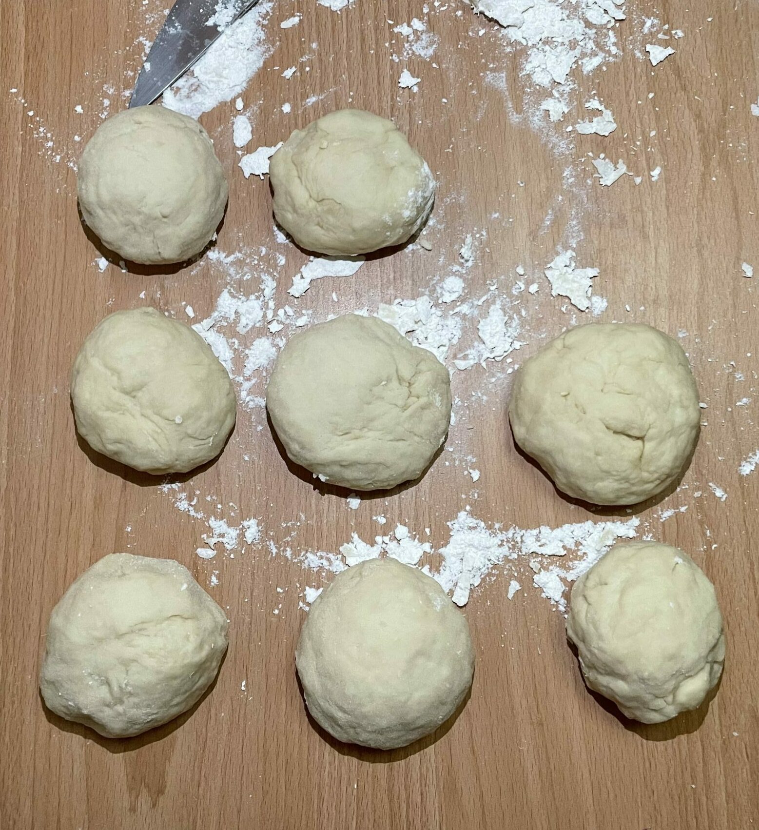 Shows the buns in balls of dough, uncooked