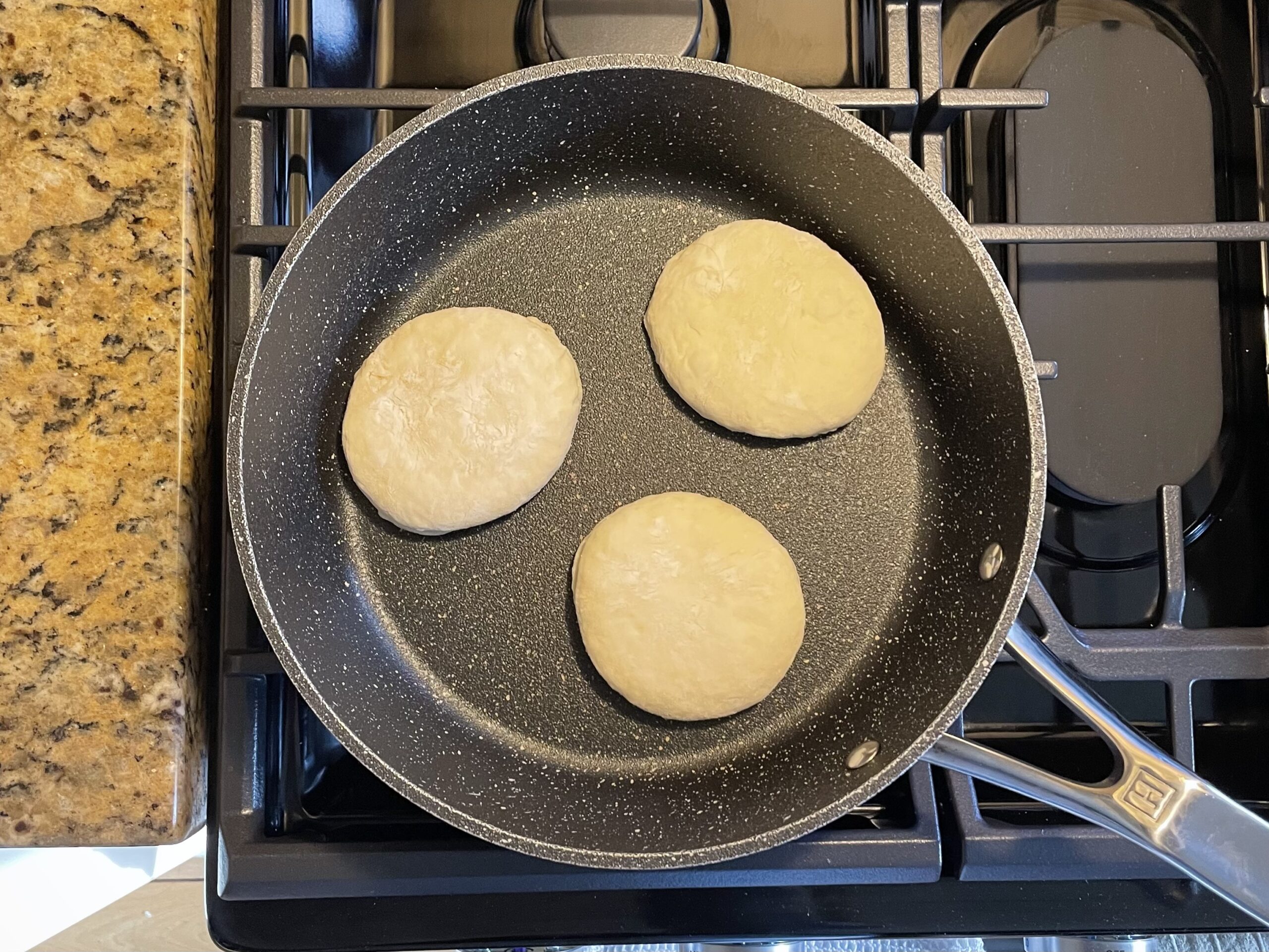 frying the english muffins on the stove