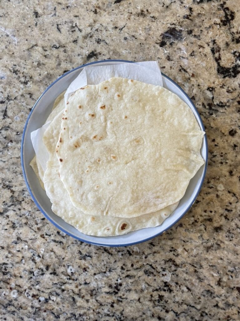 Shows the cooked tortillas